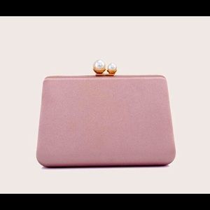 Minimalist style faux pearl clutch